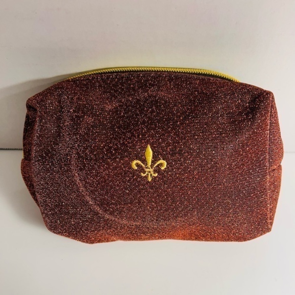 Shiny makeup pouch with fleur de lis symbol